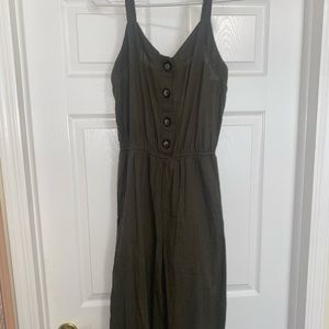 Army green jumpsuit. Just above ankle length.